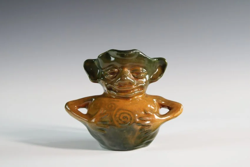 ZMA Puzzler!: Grotesque Line Figurine Pitcher by the Vance Faience Pottery Company