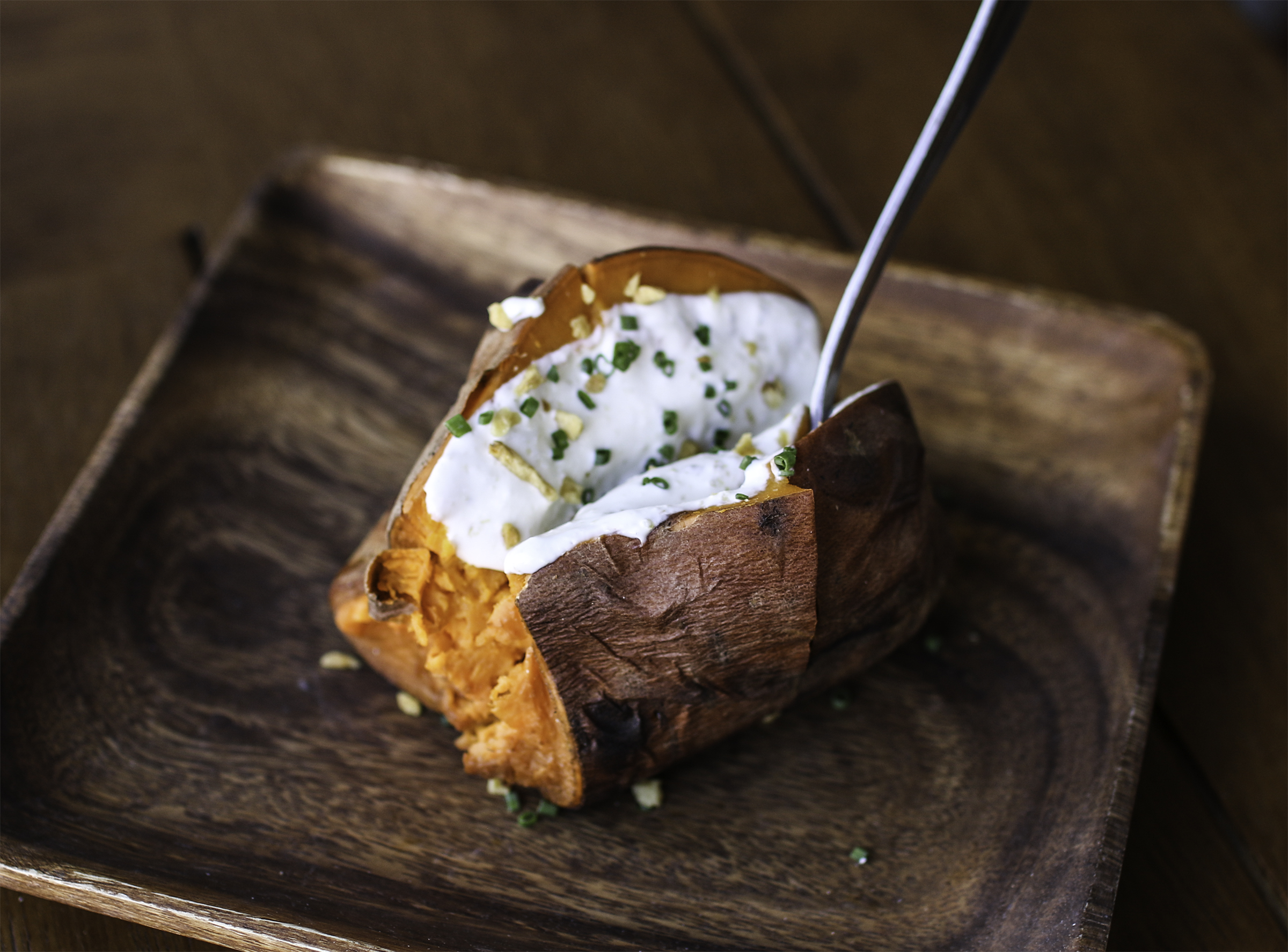  Baked sweet potato, yuzu kosho sour cream, crispy garlic &amp; chives 