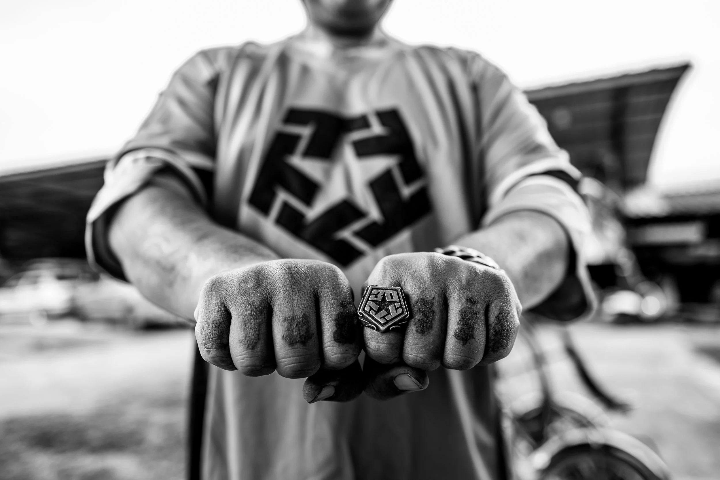 A study of gesture, hand tattoos, and personal detail.