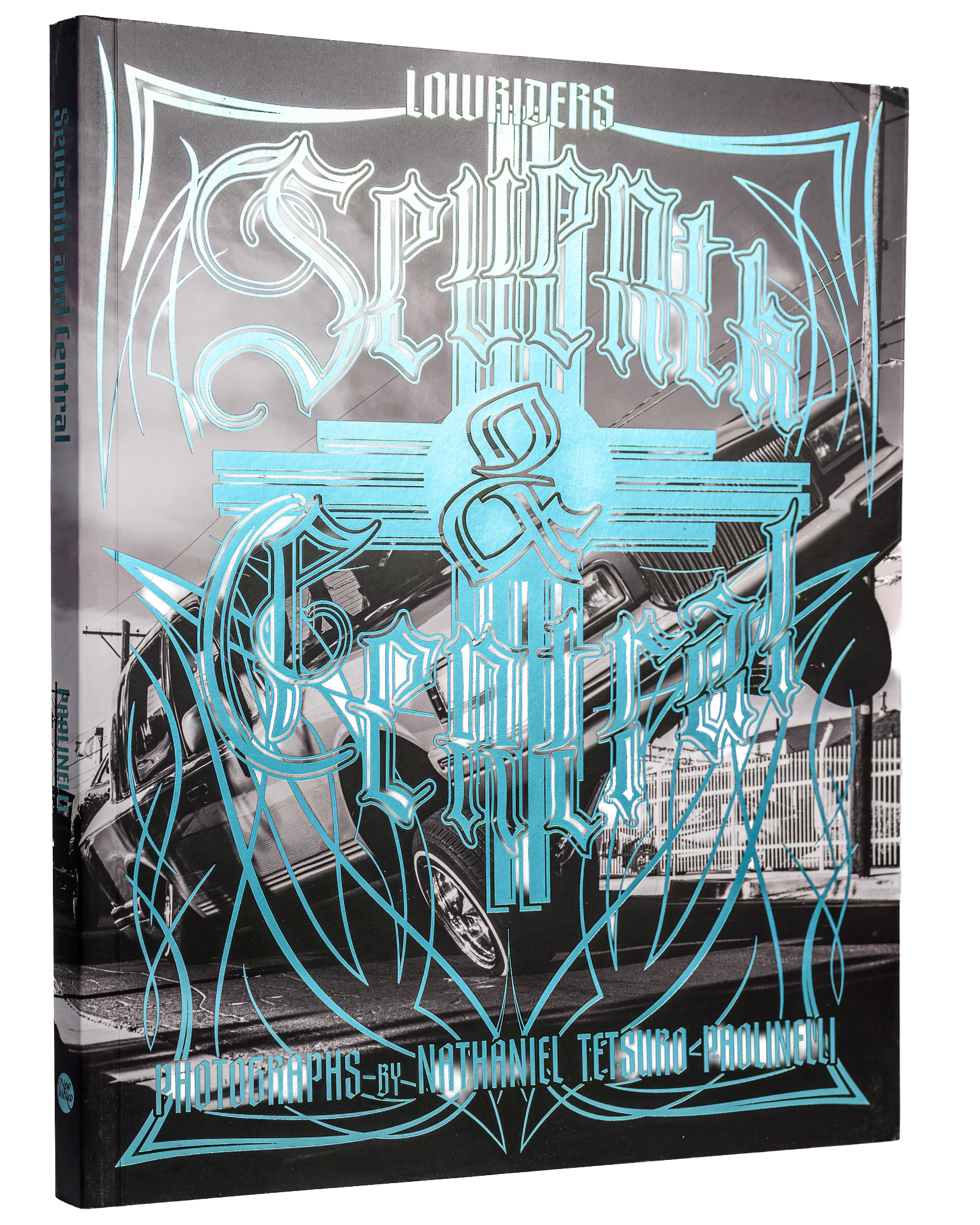 Book cover of Seventh and Central: Lowriders featuring turquoise lettering over a black-and-white lowrider photograph.