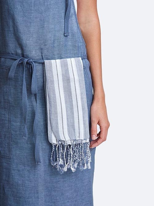 Cloth Napkins: Chan Luu's blue and white striped napkins are seen on a model's apron.