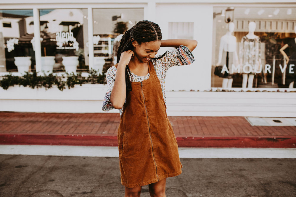 Zip-up corduroy dress in rust over a peasant top  // A Week Of 1970s-Inspired Outfits With Leah Thomas, The Sustainable Lifestyle Blogger Behind Green Girl Leah on The Good Trade