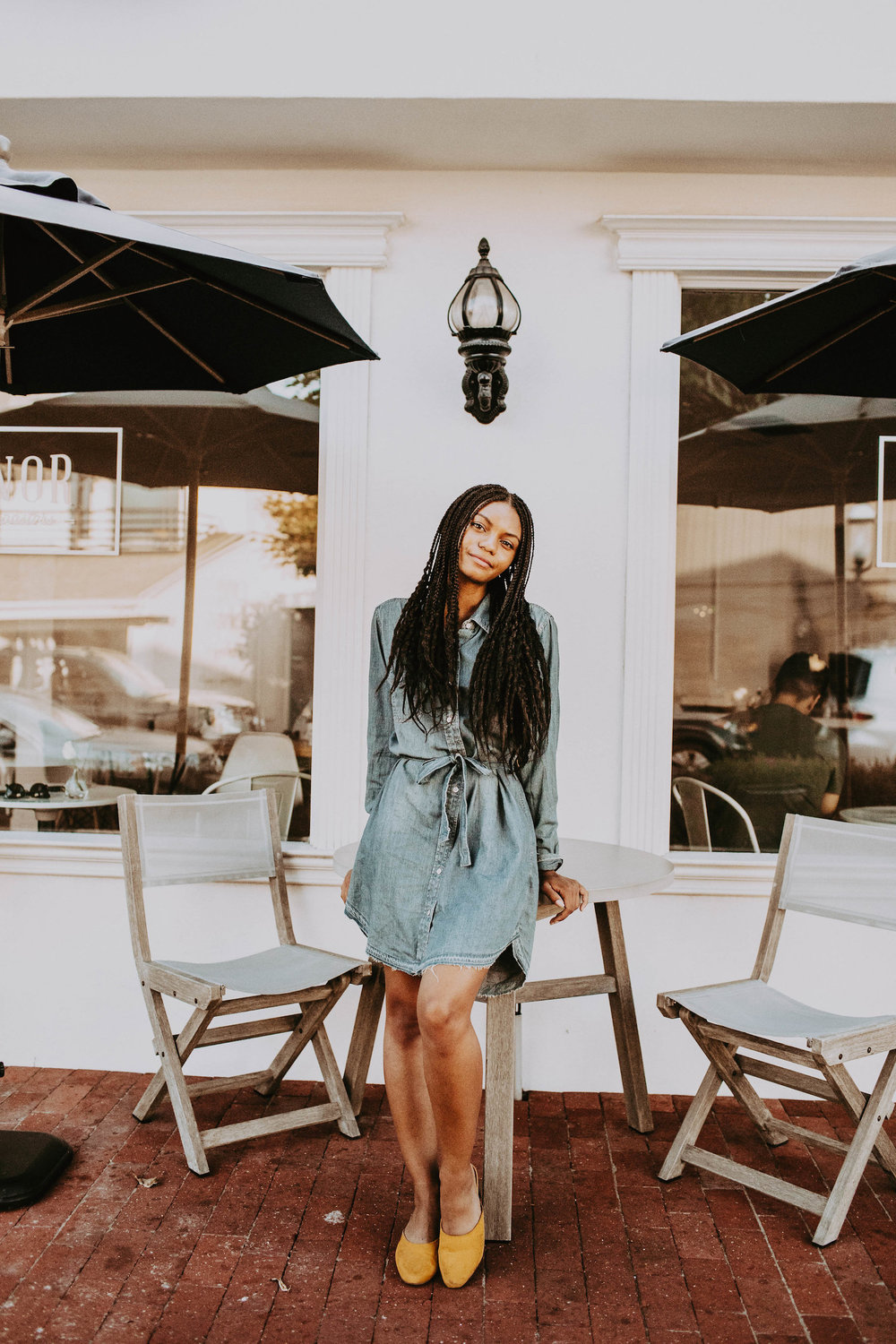Thrifted denim dress with yellow shoes // A Week Of 1970s-Inspired Outfits With Leah Thomas, The Sustainable Lifestyle Blogger Behind Green Girl Leah on The Good Trade