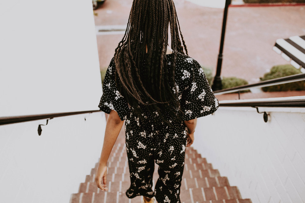 Black and white thrifted jumpsuit // A Week Of 1970s-Inspired Outfits With Leah Thomas, The Sustainable Lifestyle Blogger Behind Green Girl Leah on The Good Trade