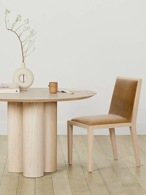 eco-friendly furniture - maiden home - brown and tan dining room chair next to a wood dining room table