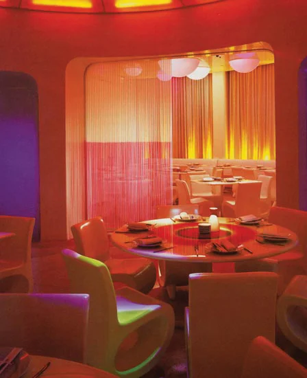 Main dining room- acrylic-coated tabletops with silk-screened patterns, view into private dining space with silicon tube curtain