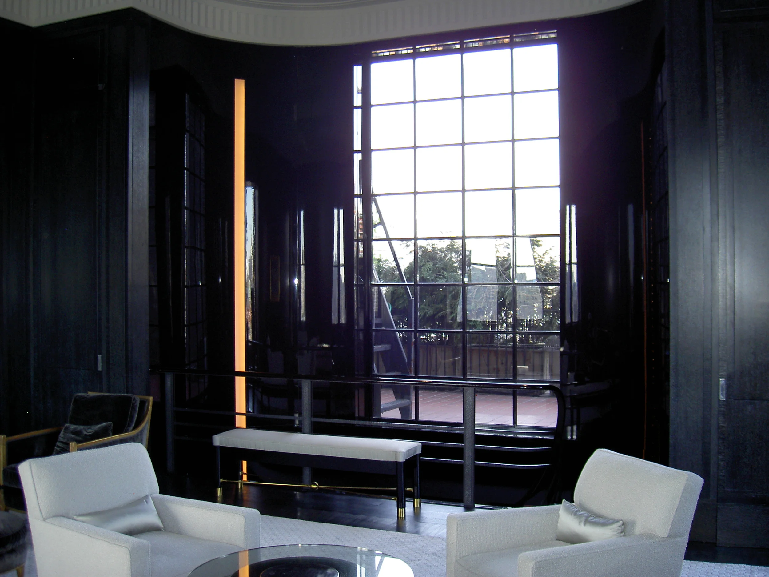 New picture window view to the Empire State Building, cerused oak and high-gloss black lacquer wall paneling 