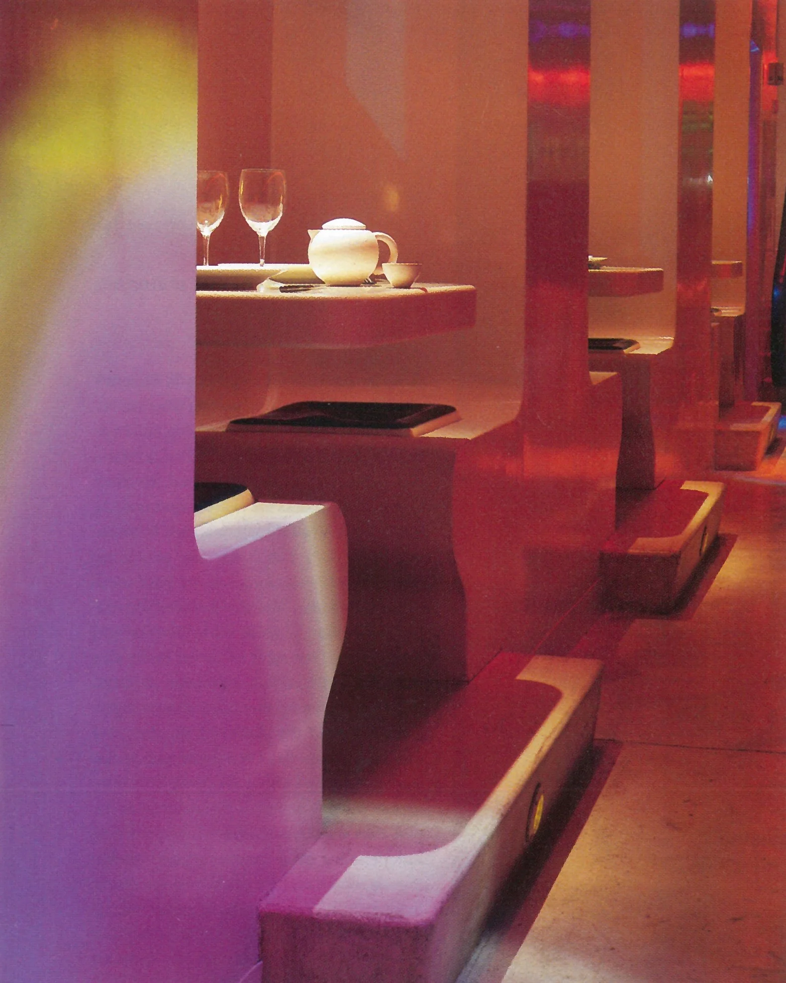 Elevated booths - Tables cantilevered to wall with gel cushions for comfortable seating