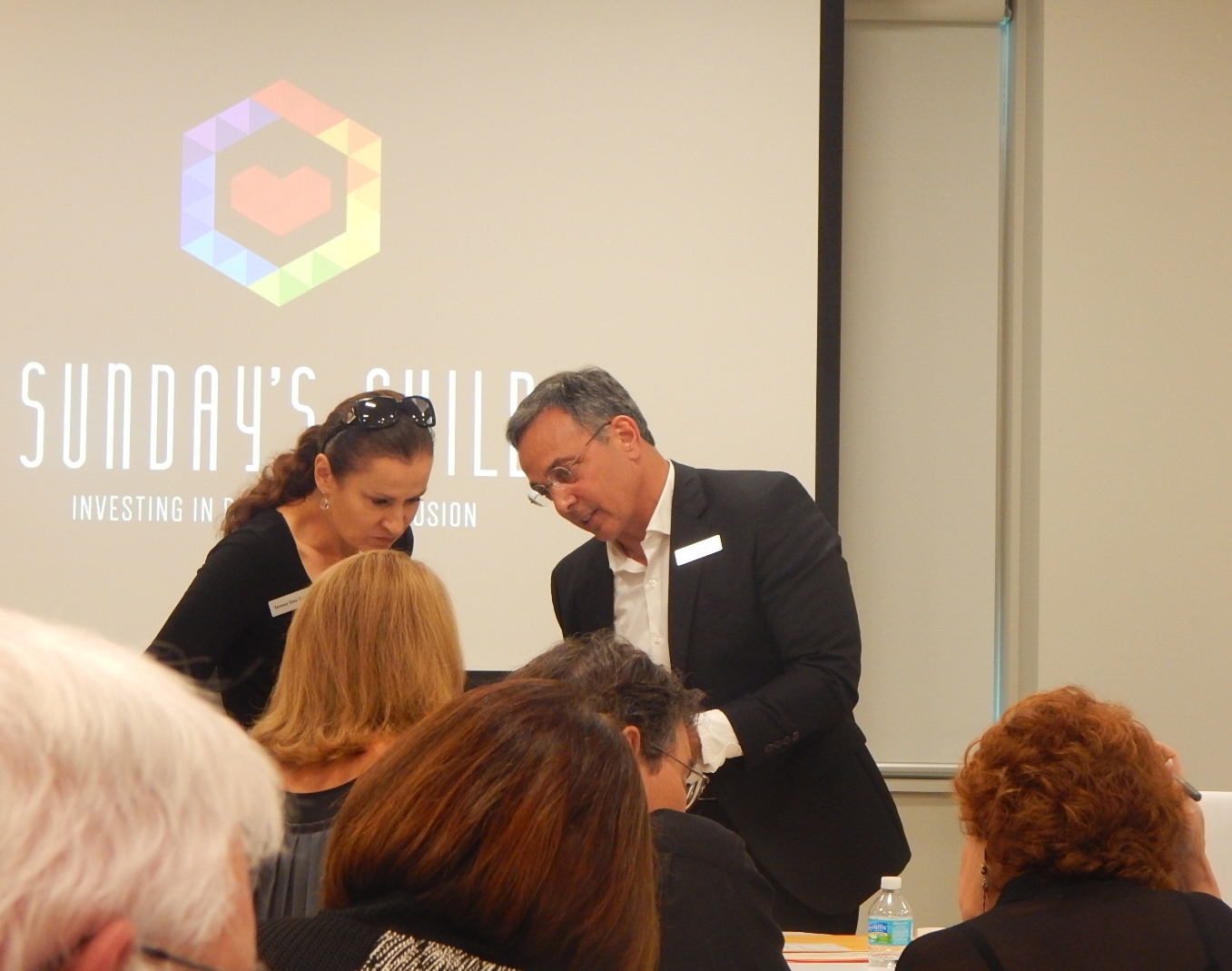 Board Member Teresa Dos Santos reviews with President, Chuck Presti, just prior to Annual Meeting.