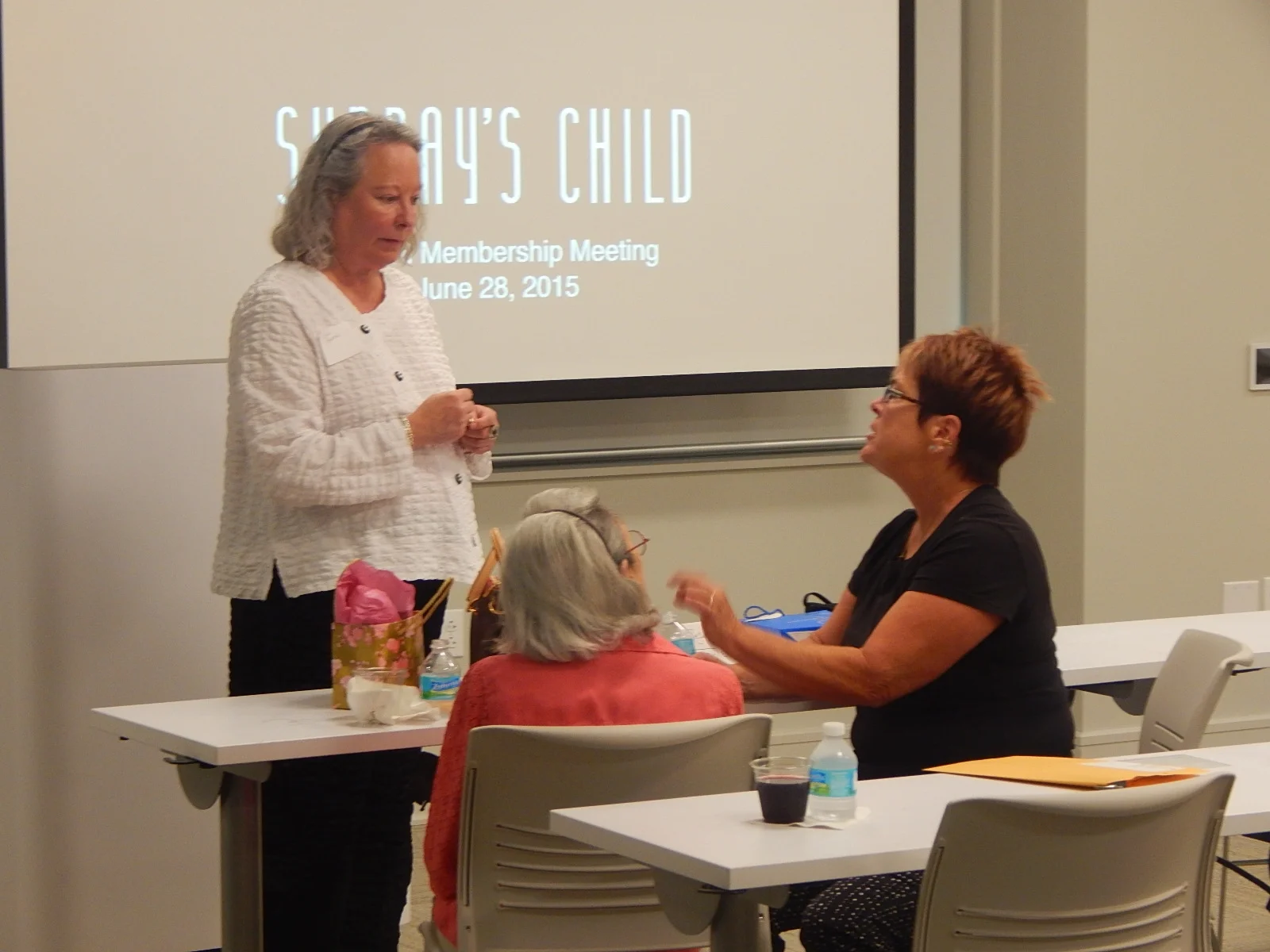 Members Vicki Baraco, Jane Kugelman and Booth Iburg.
