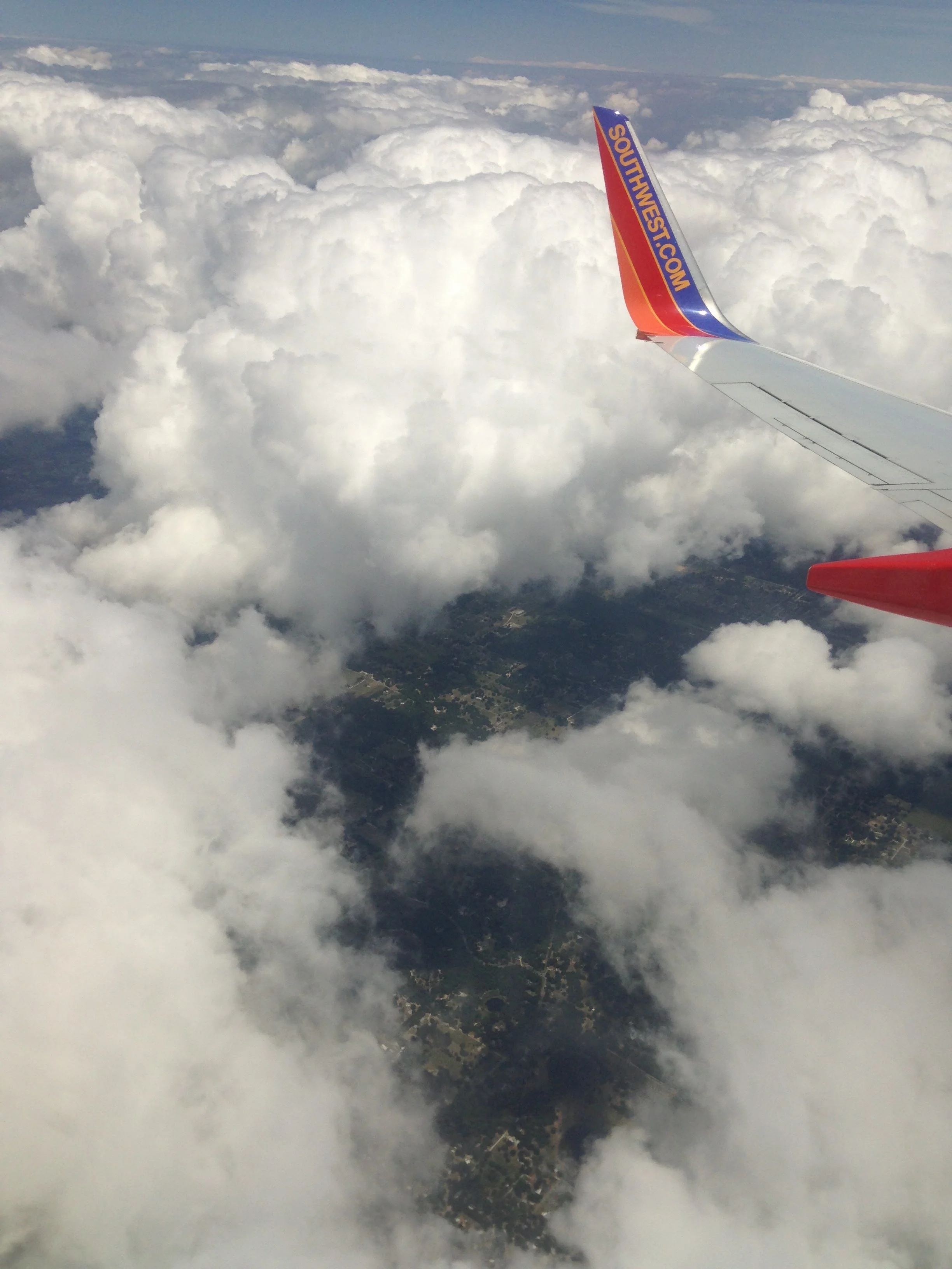 Plane-Puffy-Clouds.jpg
