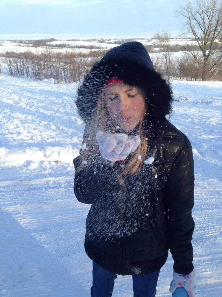 Ashlee-Blowing-Snow.jpg