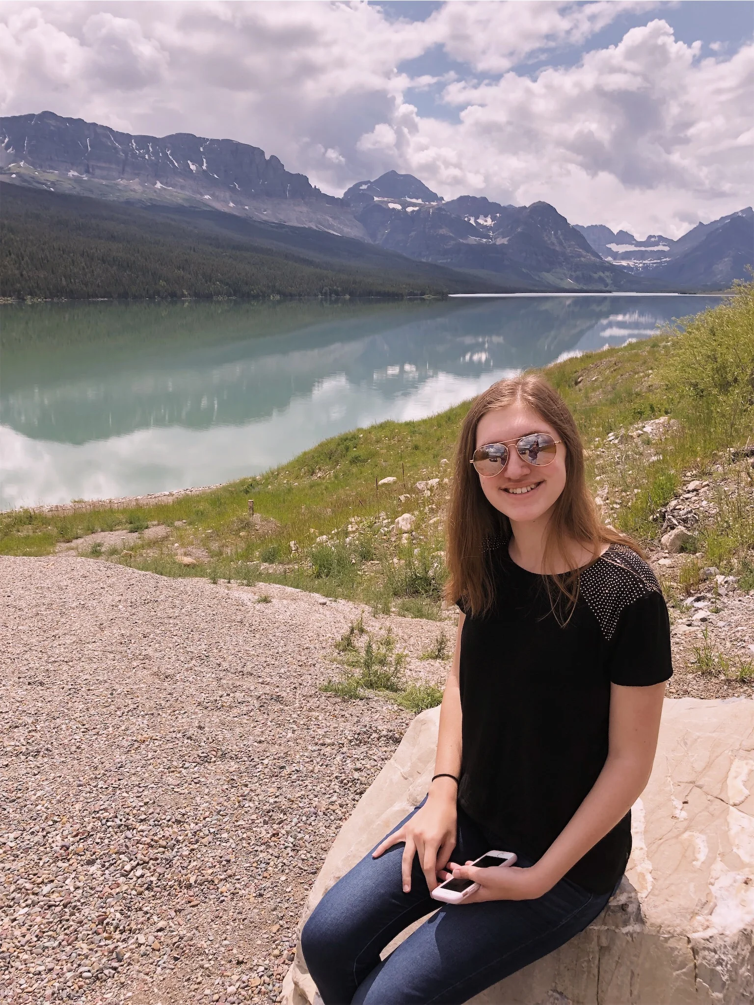 Ashlee by Glacier National Park lake.jpg