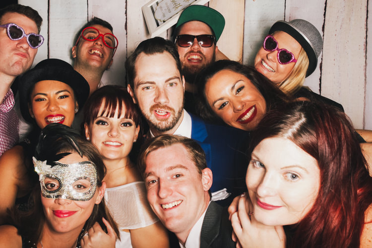 bride-and-groom-brisbane-photo-booth-hire-fun-gone-wild-party-pastel-wood-background-reception-wedding.jpg