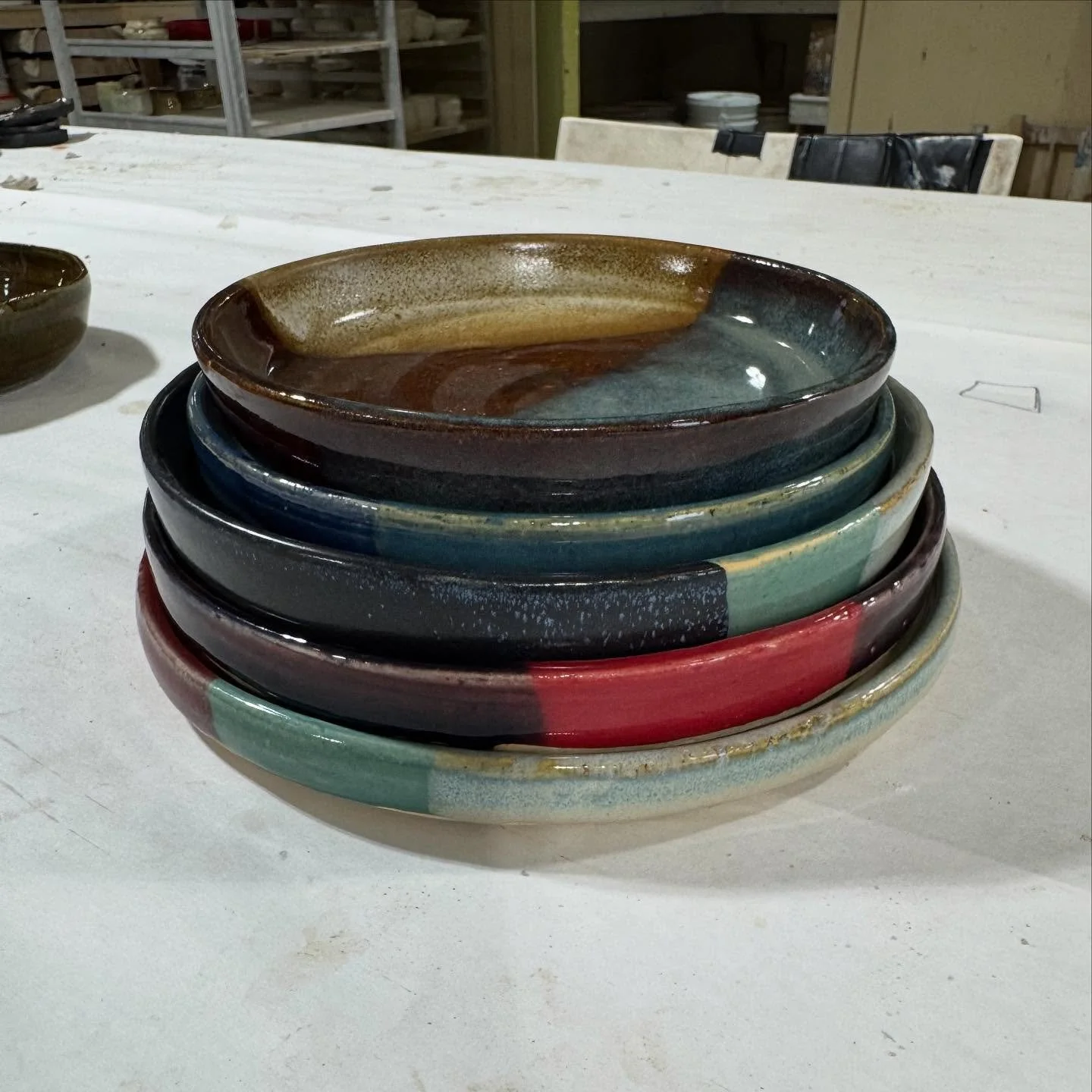Right before we left I finished up a bunch of plates, so I got to see the reveal today! 
1/3 much less green inside, but some on the outside
I like how the browns/teal turned out. 
The 3 blues is nice. 
The red/teal and light teal I did before and