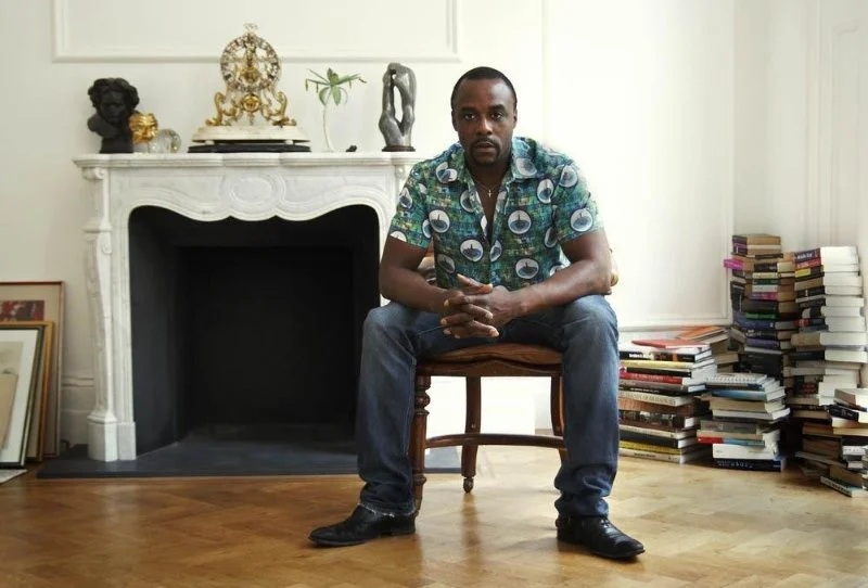 Ariyon Bakare wears clothing designed by Nicole Farhi for Children in Conflict
