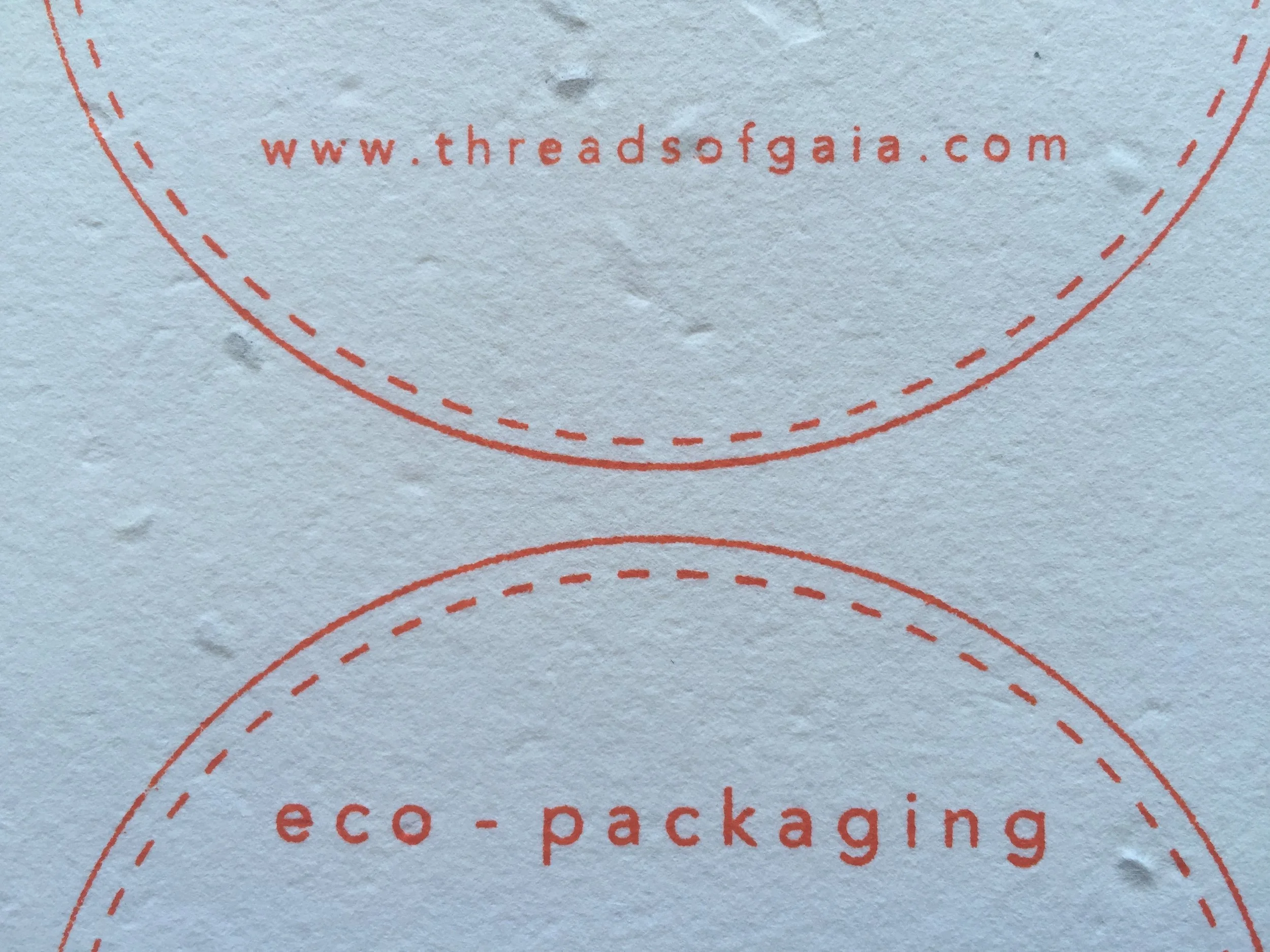 2.Find your screen-printed, seeded Threads of Gaia label. The following colour text relates to the seeds that will grow! Green label = oregano seeds | orange label = carrot seeds | brown label = lettuce seeds