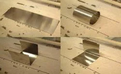 Figure 5. (top left) A sheet of mumetal (8" x 25") was laid over a sectioned off floor area. (top right) Mumetal "circular" shape on sectioned off floor area. (bottom left) Mumetal "U" shape on sectioned off floor area. (bottom right) Mumetal "L" shape on sectioned off floor area.