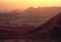Figure 2. Sunrise at Hadar, Ethiopia. Now a desert, Hadar once was an oasis supporting huge biological diversity including ancestral hominids. Image Courtesy of The Institute of Human Origins, Arizona State University.