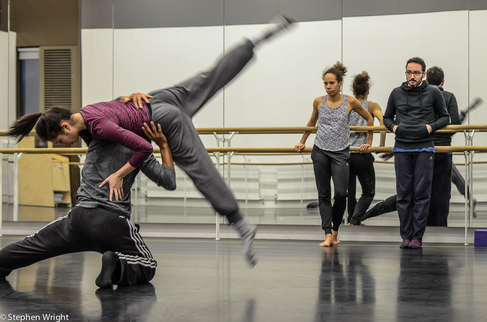 Choreographer Patricia Okenwa with assistant Stefano Rosato watching Liam Francis and Vanessa Kang rehearse a duet.