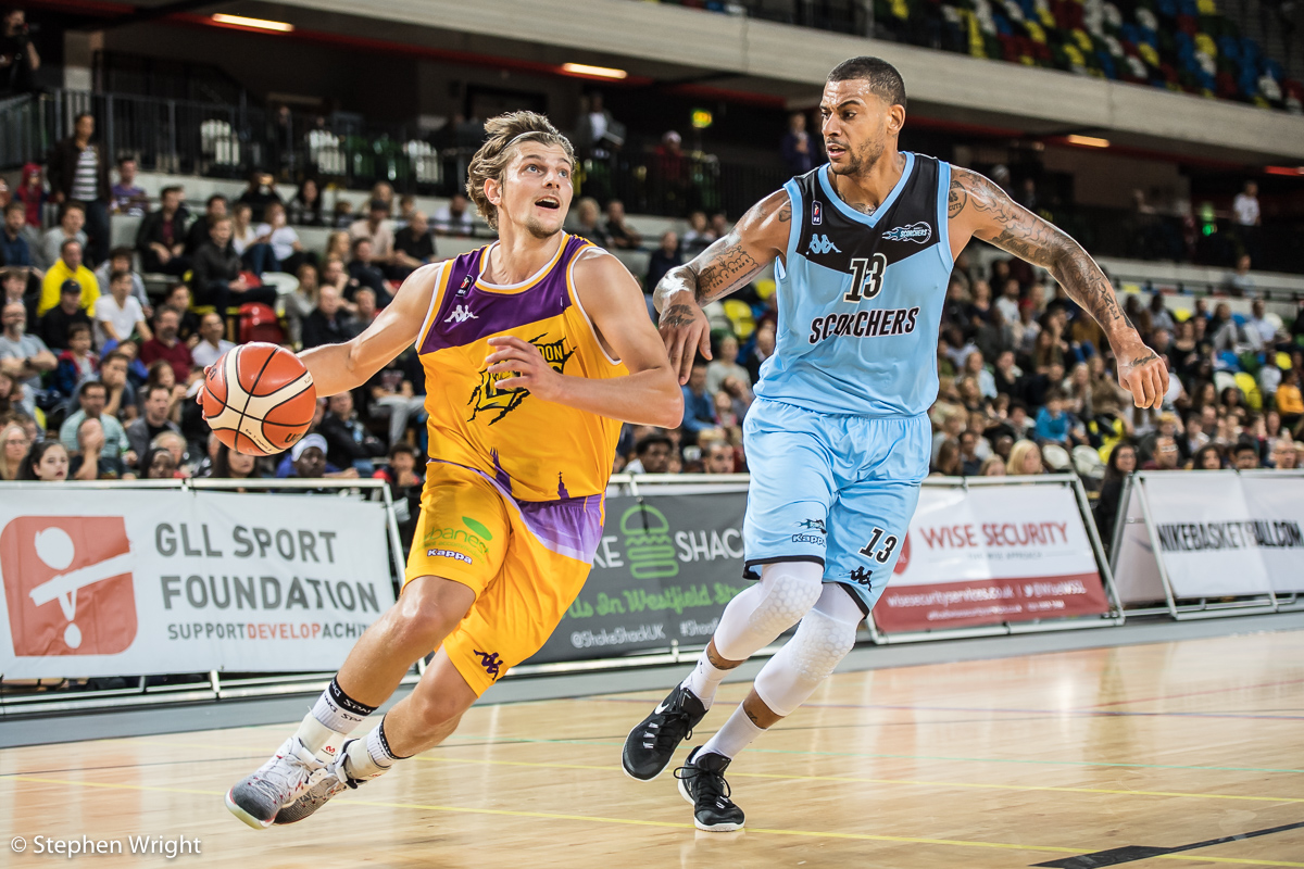 Moritz Lanegger of the London Lions faces off with Gerald Robinson of the Surrey Scorchers .