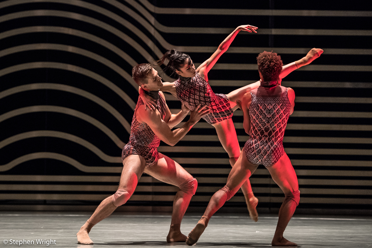 Adam Park , Brenda Lee Grech and Liam Francis performing Rambert 's, Symbiosis choreographed by Andonis Foniadakis .