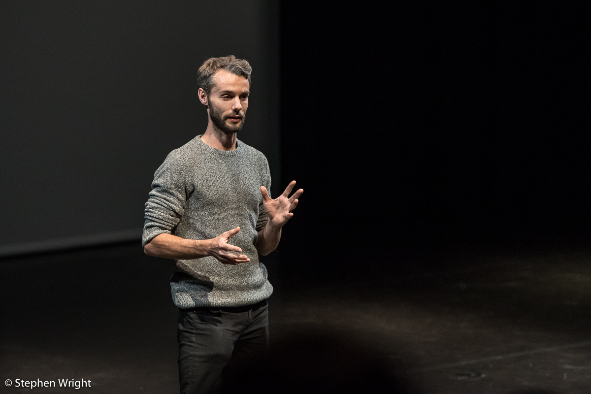 Alexander Whitley speaks during the showcase performance in partnership with both the Gillespie School and the Alexander Whitley Dance Company .