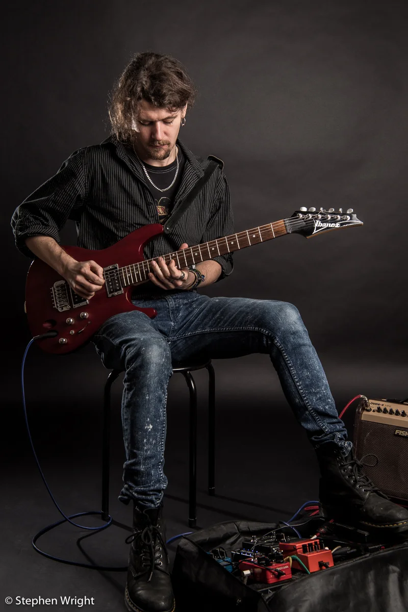 Musician Alex Paton on set during his portrait session.