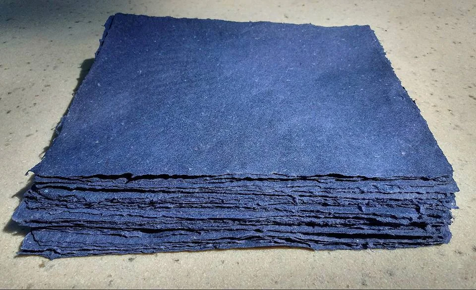 Sheets of pigmented blue "garbage" pulp made from cotton, abaca, gampi, kozo, and flax.