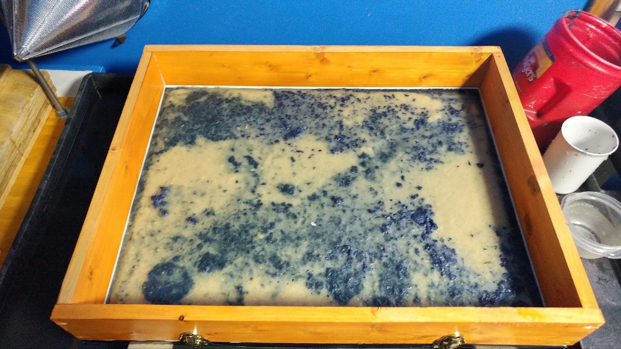  Making paper using bleached iris fibers, pigmented kozo, and the house blend. 