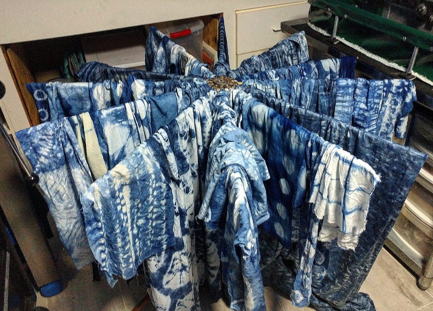  Over fifty pieces of shibori-dyed fabric drying. 