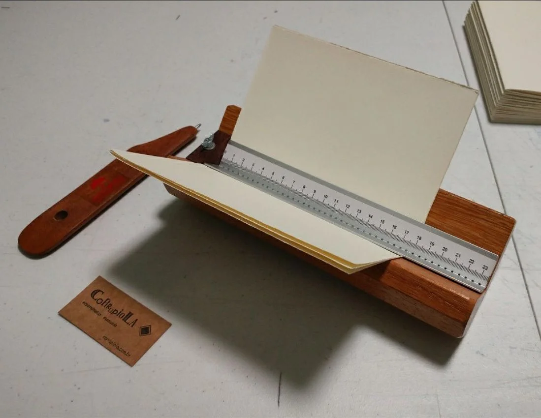 Prepping signatures for bookbinding.