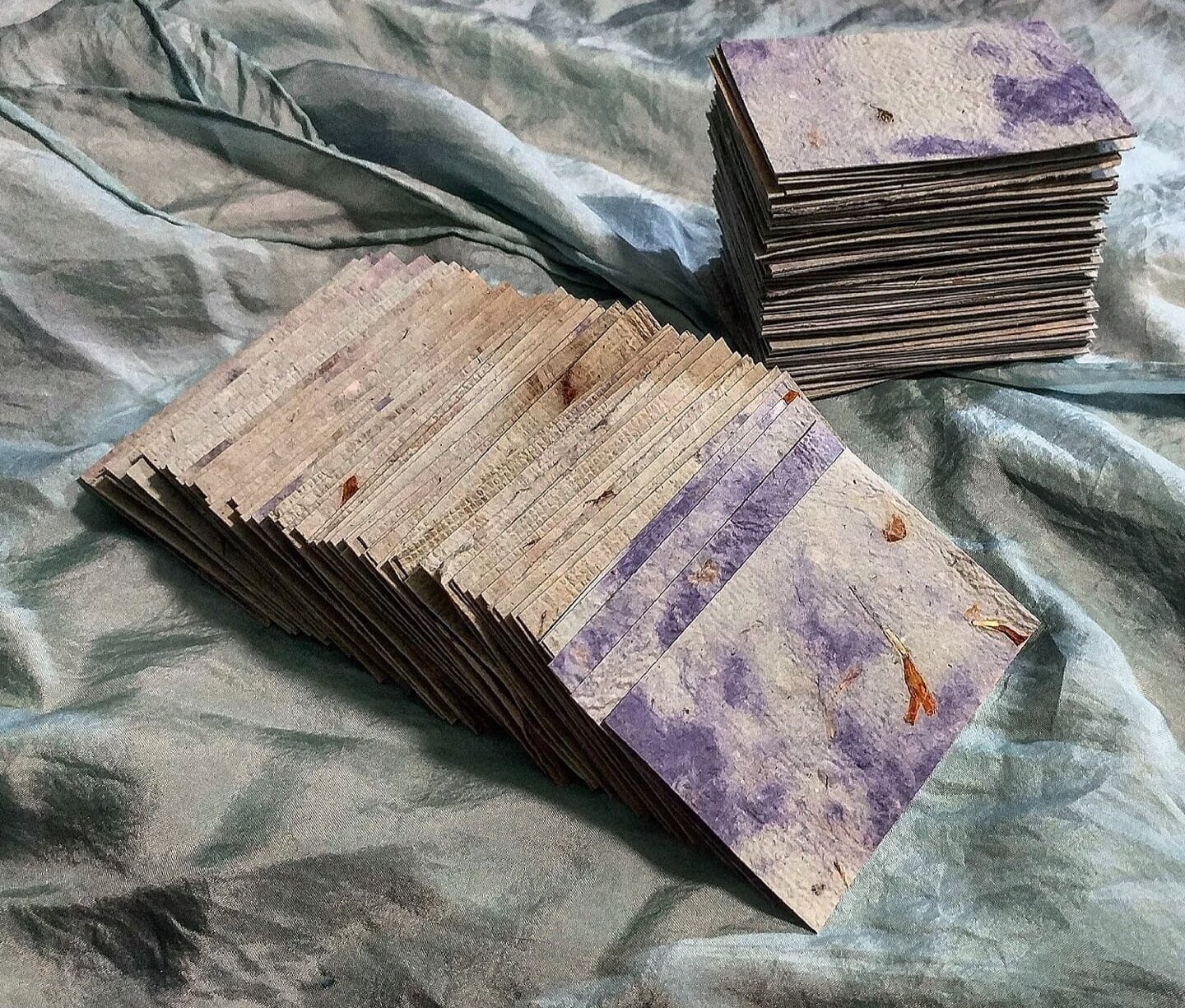  108 swatches of a one of a kind special blend of handmade paper (cotton, abaca, kozo, gampi, iris, hosta, flax, daylily, dracaena, cordyline, yucca, butterfly bush, rose of sharon, reed feather grass, porcupine grass, ribbon grass, cattail, cattail 
