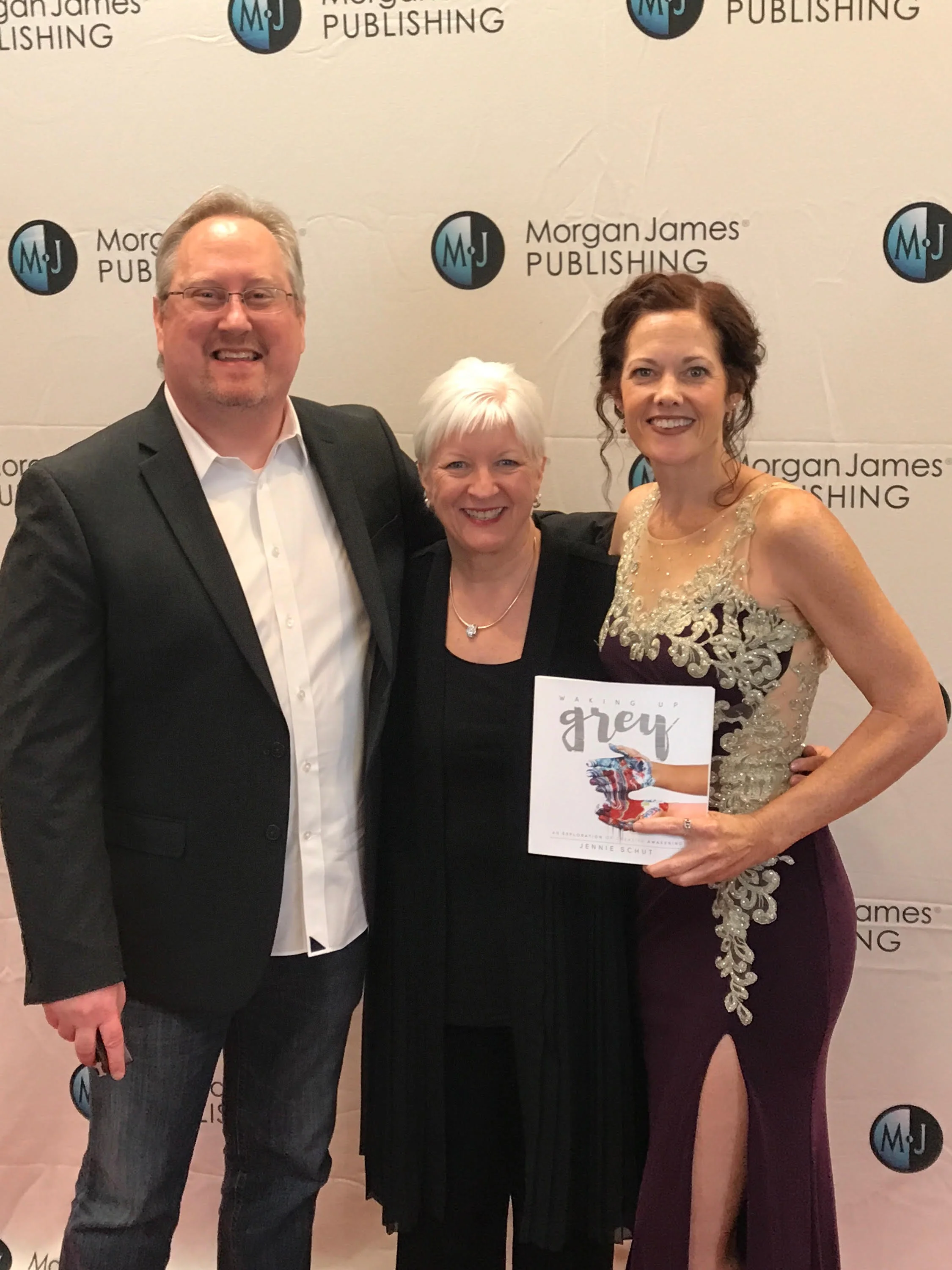 My publisher, Morgan James Publishing, with offices in New York and Virginia, held a Red Carpet event for the Spring/Summer 2017 authors recently here in Nashville, TN. And what an event it was. I had never attended a "red carpet" event before and probably never will again. And as a mom of four and a studio artist, you can usually find me in jeans with holes, an old t-shirt and my painting apron. This night, I had an opportunity to dress up and look like a girl. There were close to 20 authors being celebrated that evening and I was grateful to be one of them. We all had an opportunity to walk the red carpet and talk a few minutes about our books. You can catch the video here . Pictured with me in the photo above is the founder, creator and leader of Morgan James Publishing, David Hancock. In the middle is Morgan James acquisitions editor and dear friend, Karen Anderson. Karen went through my material early on, as it was being written and birthed. She was so formative in the process and important in the way Waking Up Grey was created. And she believed in the process and the project so much that she made sure that it got to the right place so that it could reach as many as possible. One thing became clear as I met the Morgan James family face to face for the first time over this event. All that have hands in the publishing process deeply care that the passions and voices of the authors get to the people they need to get to. They are careful and selective about the content they are putting out into the world. I learned that MJP gets 5,500 submissions a year and only chooses to release 200 titles a year. I am deeply grateful to be included in such a selective, hand chosen group of books. Their belief in me and what I am passionate to say reminds me why I am doing what I do. It is because of my passion for you, the reader, to find a deep sense of freedom and spaciousness within yourself to do all that is in your heart. God doesn't just approve, or give us permission to follow our dreams. He is the one that actually plants our deep desires and longings and everything that is in our lives will either water that plant or wither it. My prayer is that you are making movements toward more life and light and flourishing. God wants you to flourish. He wants goodness and joy and beauty and creativity to have a place to be nourished and to grow within you. It must begin with you. You must be nourished first before you can extend it out. And, like I found over the course of the publishing process, you will begin to find those in your life that believe in your dreams and your work just as much as you do. Look for those people and reach out and ask for help. As you begin to make small steps, you will begin to see that the universe is eager to help. It is abundant and generous, not scarce and rigid. I hope your voice begins to take up more space and your dreams begin to move from formless and void into particular shapes and textures and colors. That's my hope for you. Look in the coming weeks for more from me as your creative midwife. I'm here as a resource for you! Let's dream and fly together!