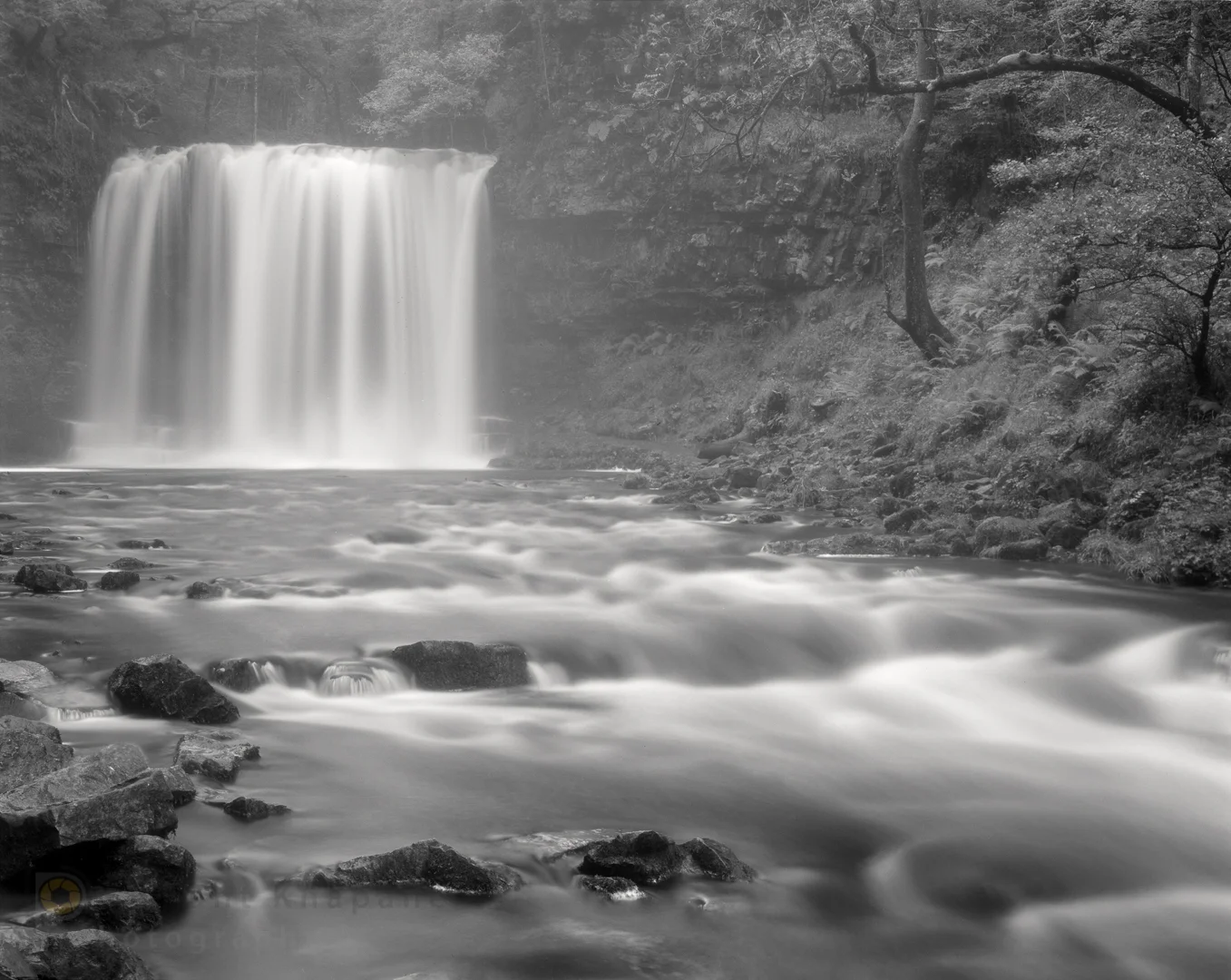 Chamonix 45N2 with Rodenstock Sirnoar S 150mm/f5.6. Ilford fp4+ exposed at ISO100. Rocks in the cascade exposed at Zone 3 and developed for 6:15 min in Ilfosol at 21C. Click to view large.