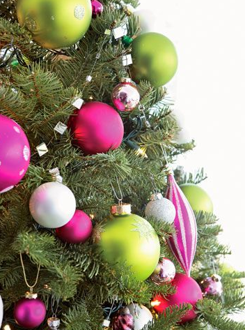 Consider coordinating your holiday decor with your holiday party. Don't you love the bright green and pink ornaments? Such a fun and fresh tree theme. Add some glitter for the perfect party palette. 
