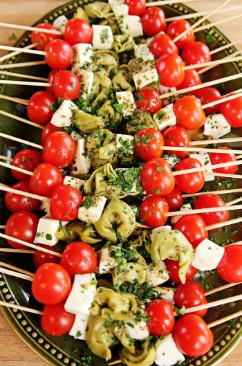 This is the easiest (and most delicious) green and red food you can serve. Tortellini, tomatoes, fresh mozzarella and lots of pesto is beautiful and delicious. When planning your menu, consider color coordination for a beautiful table. 