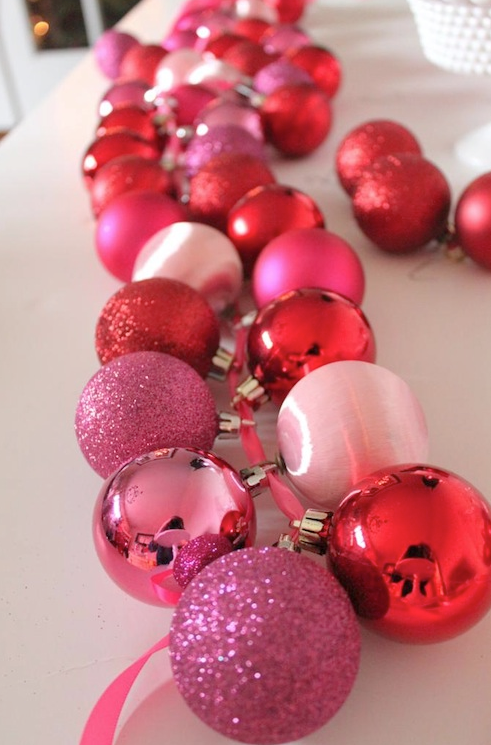 The easiest way to coordinate a color themed party is with the decor. Keep DIYs monochromatic for a chic look that's sure to stun. This ornament garland is super easy and beautiful across the table. Plus, it makes a big impact for not a lot of money.