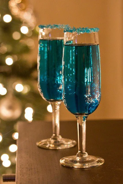 You've got to serve a festive drink! Bonus points if that drink fits your color theme! Wouldn't these bright beauties be a fun addition to your holiday soiree? We love special details like the sugar rimmed glass. Find a few areas to really go over the top to wow your guests! 