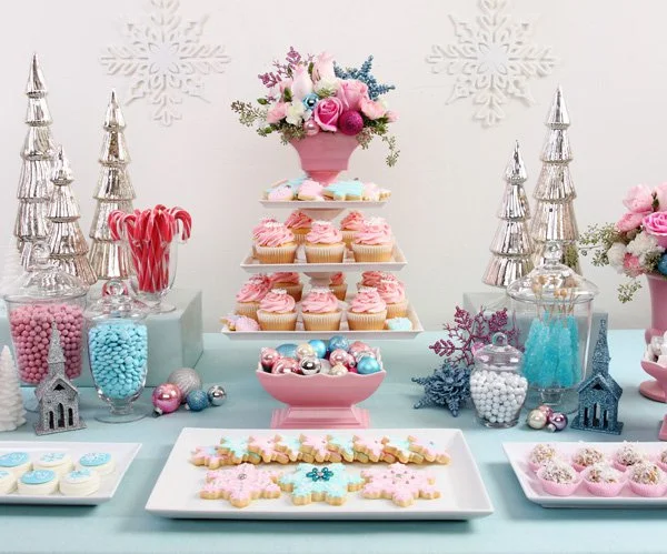 Add levels to the food display for visual interest. We especially love wrapped boxes to add height. When planning the menu consider the visual appearance of your food and how it will add to the party. Add decor and color coordinating details to make the food table match the theme of the party. You can't got wrong with a dessert table! Add color coordinated candy to tie everything together. 