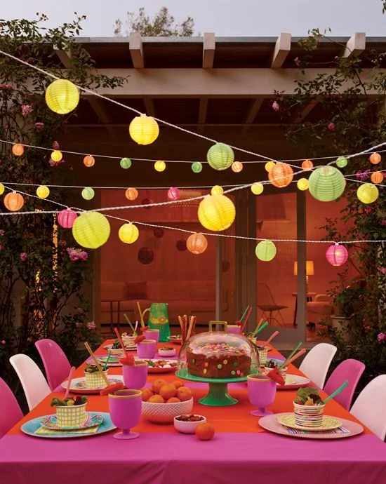 SO MUCH GOODNESS! We love the lights, (a nod to the invite) and the bright dishes and decor. Show your guests you care by putting a little extra effort into the details of your party! 