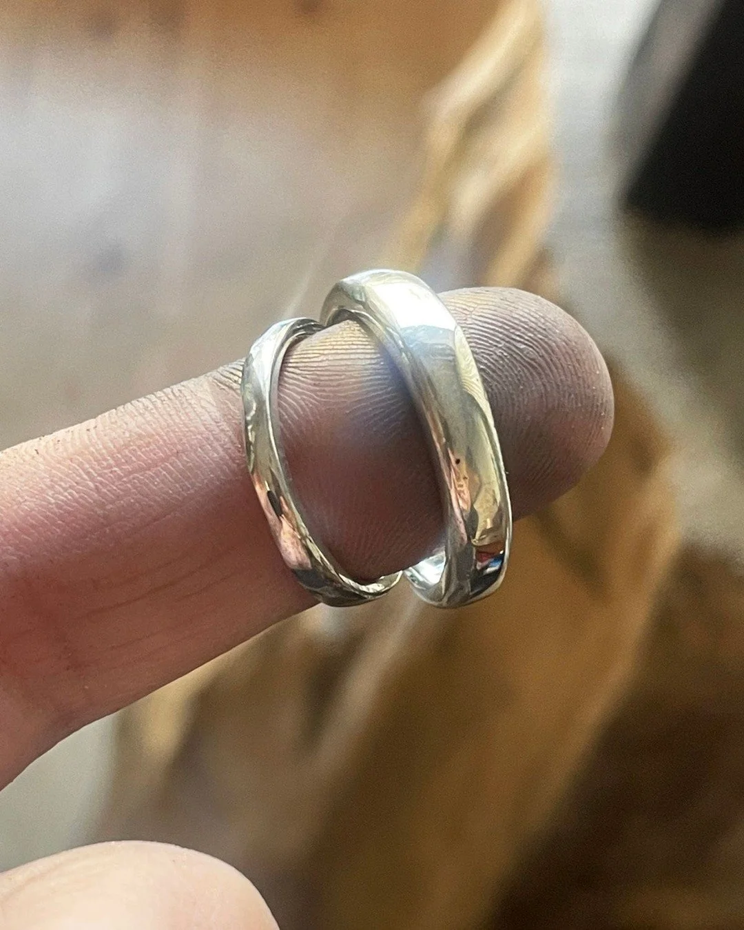 The first pair of @fairminedofficial wedders to roll off the bench, post polish, pre setting, with gold and silver from @fairevergold.

We made a solid super comfort fit sand cast band for C, and a mixed metal 14k yellow gold and silver band for N. C