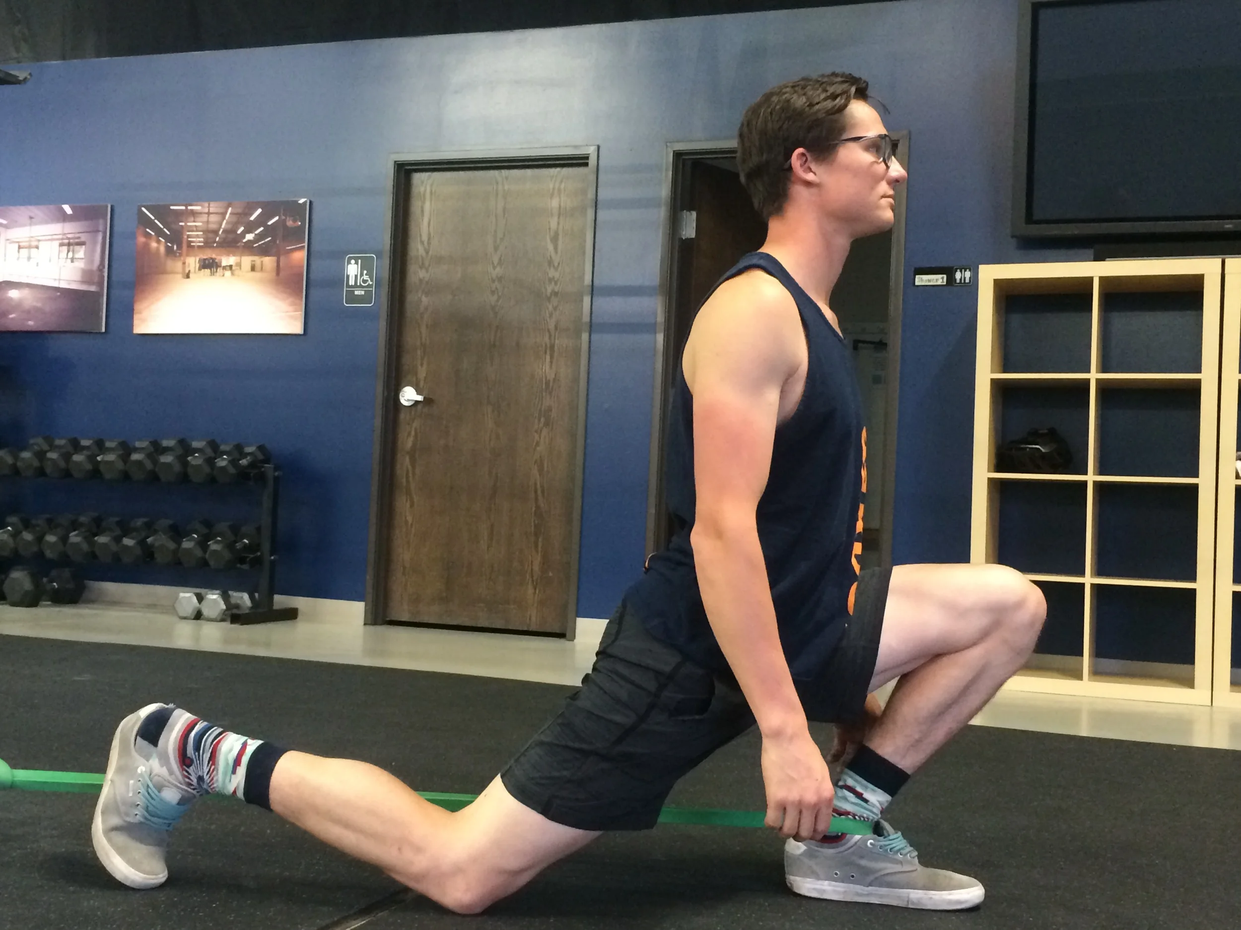 Attach a strong resistance band to a rig or other solid setup at ankle height. Step one foot into the resistance band and position the band to fit at the base of your ankle. Take a large step forward and scoot yourself out as far as you can. From here step into a low lunge (like your stretching your hip flexor) with the banded ankle forward and use the weight of your upper body to push your knee forward and out to the side (not towards the center). Work on each ankle for 2 minutes. 