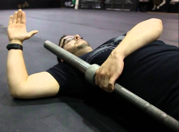 While lying on your back bring your arm to a 90-degree angle making sure your elbow and shoulder are in line. Use a barbell to pin your anterior deltoid (the front of your shoulder) down. Without letting your elbow slide towards your hip, begin to move your forearm through full range of motion. Try to bring your palm to the floor as well as the back of your hand to the floor. Continue moving for 2min before switching sides. 