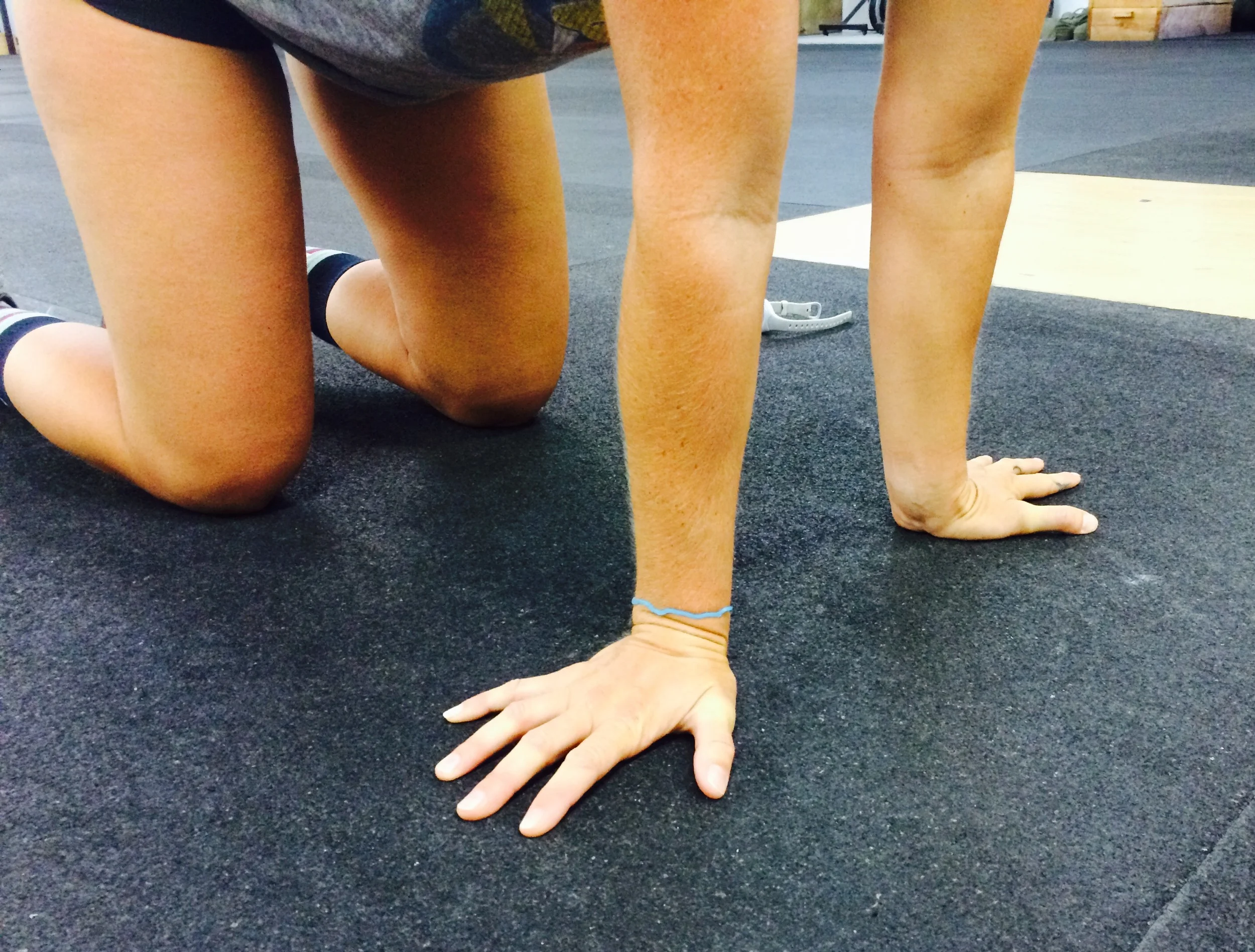 From the same stance as the previous exercise, turn your fingers out to the sides. This time rock side to side instead of front to back. Really lean into each side using your body weight, keeping your elbows straight, while keeping palms planted. 