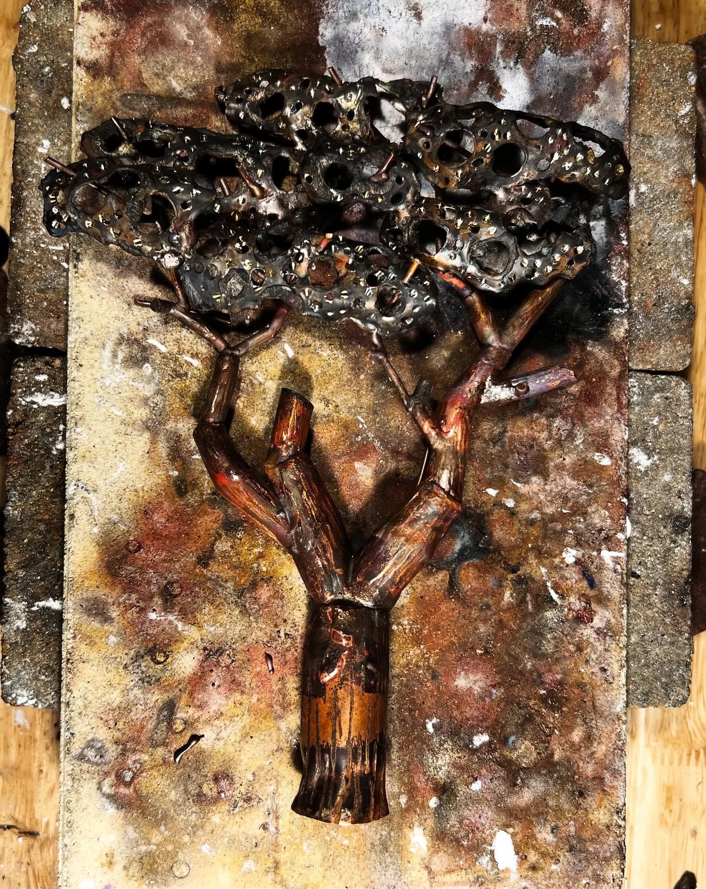 A fabricated, smaller size tree made out of copper and nickel that I just wrapped up.