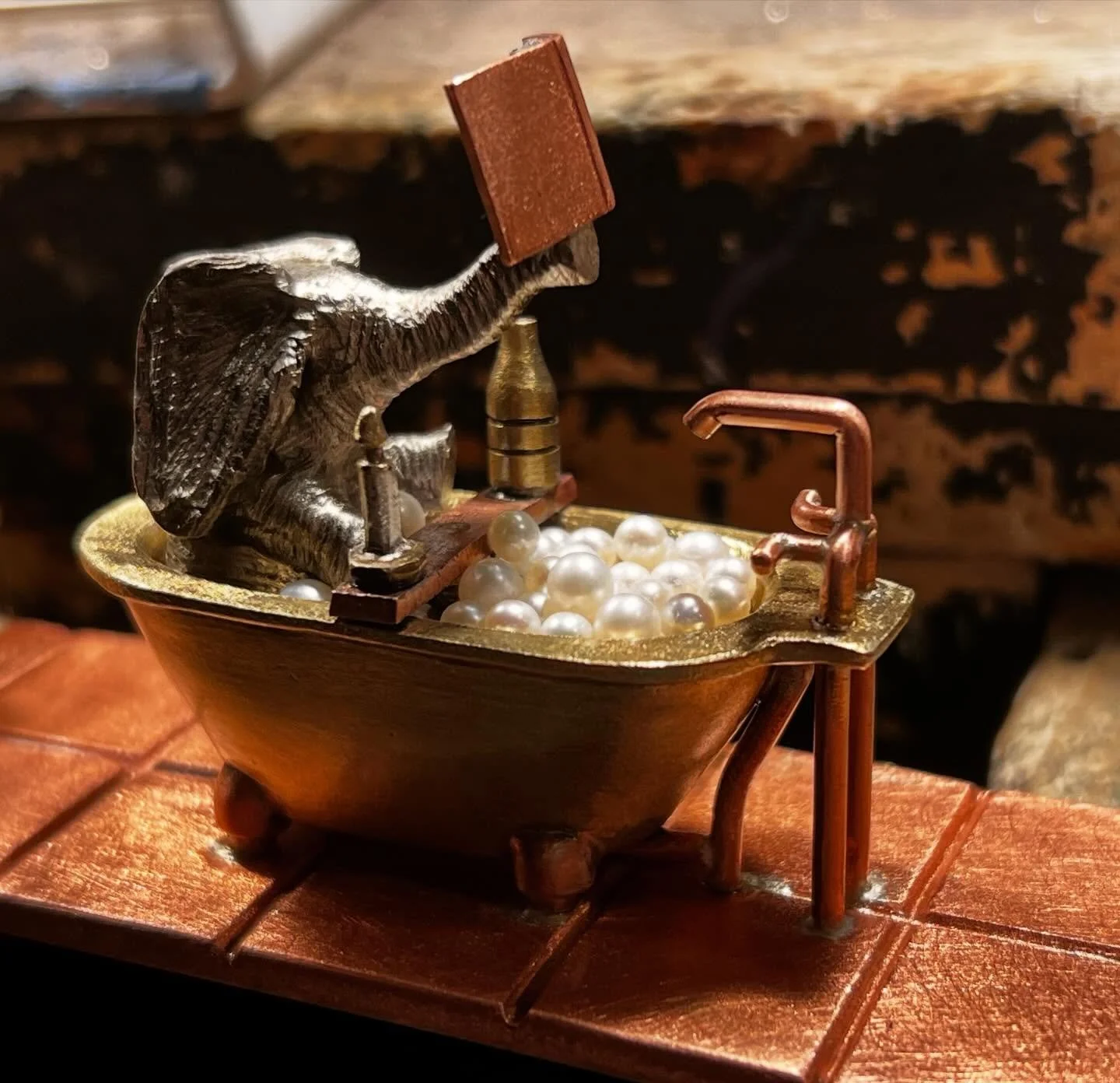 Who needs a bubble bath with a bottle of wine, a candle, and your favorite book?

A lot of work goes into this bubble bath. Each natural pearl gets its own post so they are not just randomly glued in place. Setting each pearl is quite tedious.