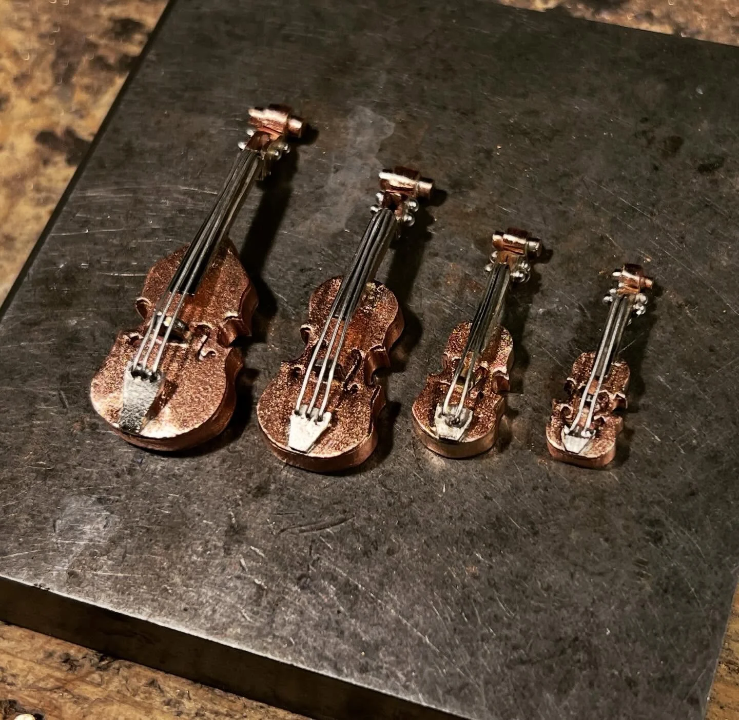 String set fabricated out of copper, nickel, and sterling silver.