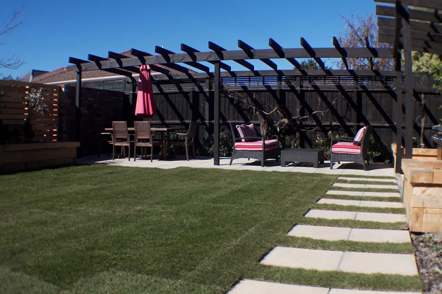 landscapes-unlimited-backyard-tiles-pergola-lawn.jpg