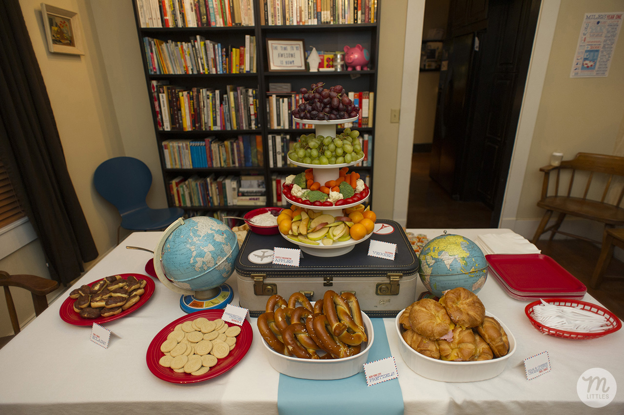 Chocolate eclairs for Paris, president cookies for Washington, D.C., fruits and veggies for California and Seattle (Washington Apples), pretzels for New York City, ham and cheese croissants for France.